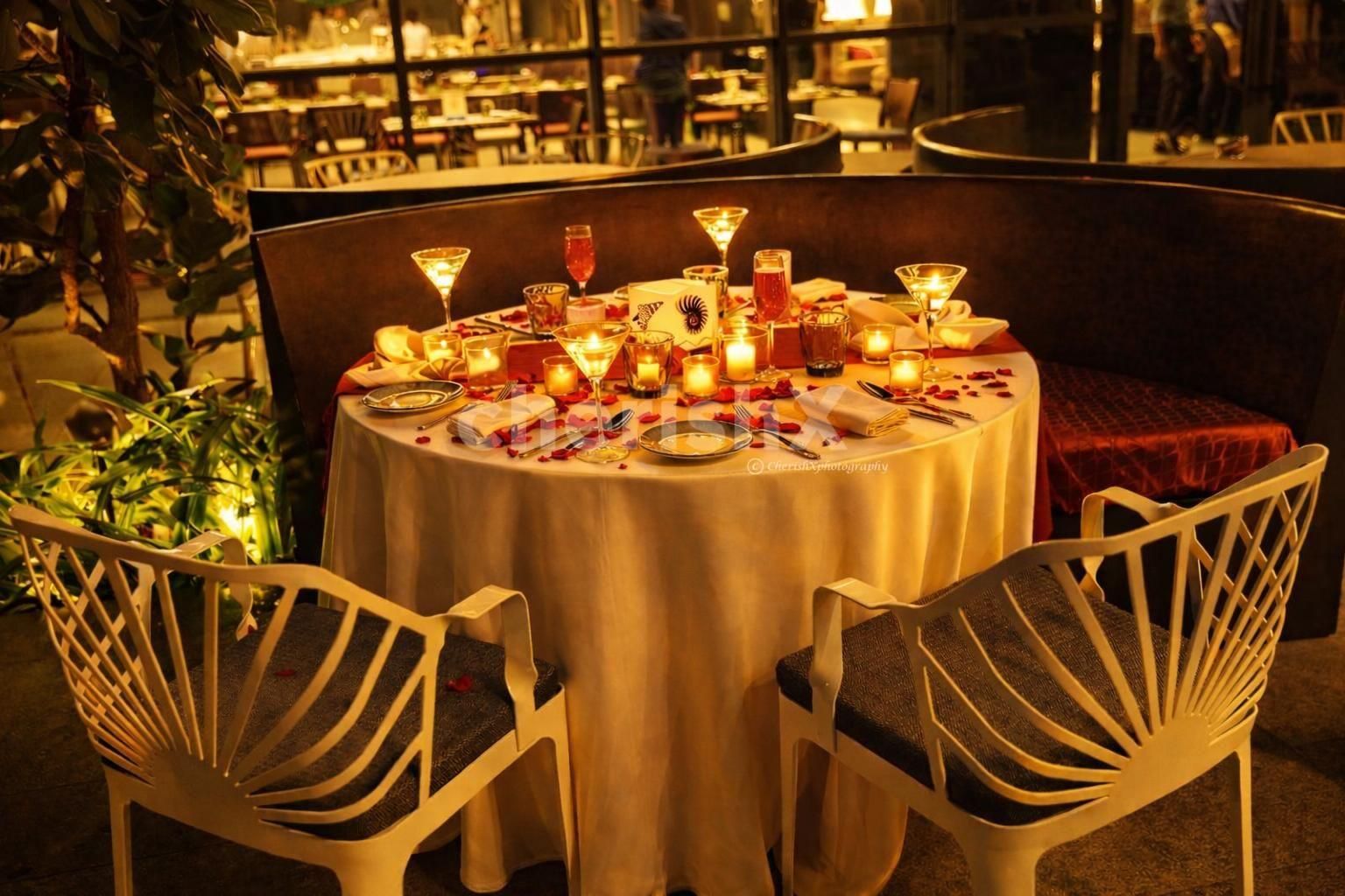 Celebrate love with a beautiful alfresco candlelight dinner experience at Hilton Manyata Tech Park, Bangalore.