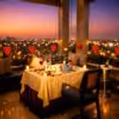 An enchanting open-air terrace candlelight dining experience at Royal Orchid, where romance meets the glow of city lights