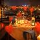 Soft candlelight, rose petals, and elegant décor set the mood for a magical terrace dinner at Royal Orchid.