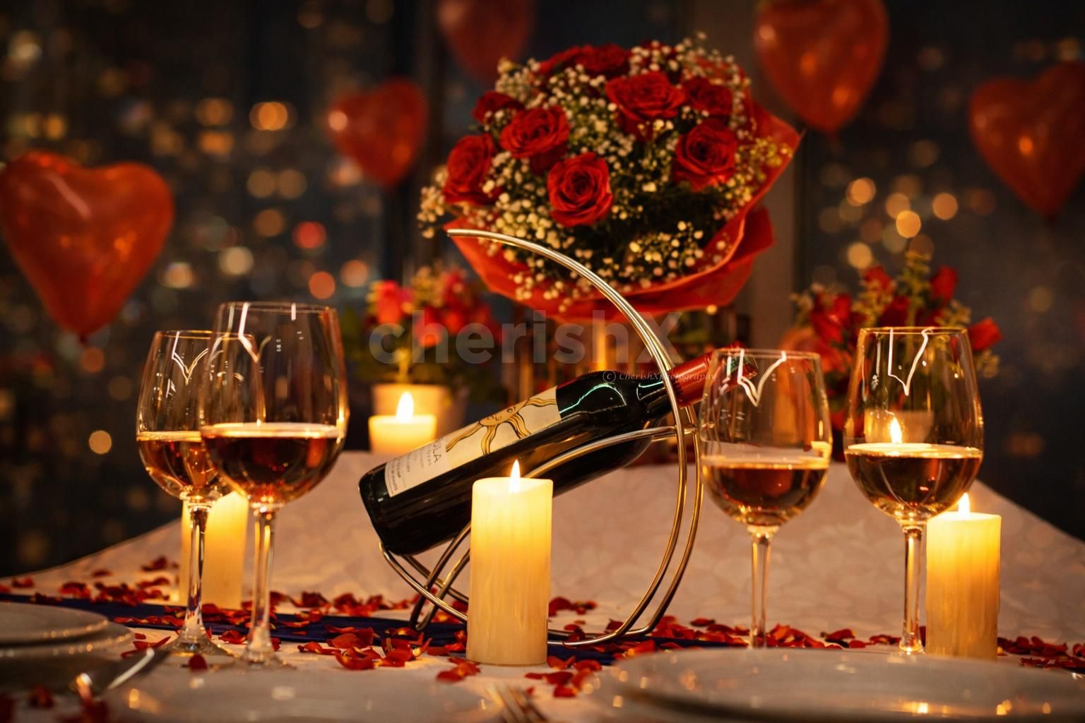 Indulge in a cozy candlelight dinner surrounded by roses, wine and warm ambient lighting.