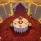 Private Open Air Dining Setup With Candles And Rose Petals To Add Romance