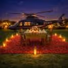 Luxury Open-Air Setup With Chopper Backdrop For Romantic Dinner