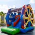 A classy Ferris wheel bouncy house can be installed on a large open space.