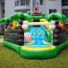Dinosaur jungle bouncy house setup for an exciting kids' birthday party