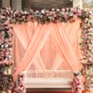 Glass candles on the floor and a stand add the vintage touch with their timeless magic