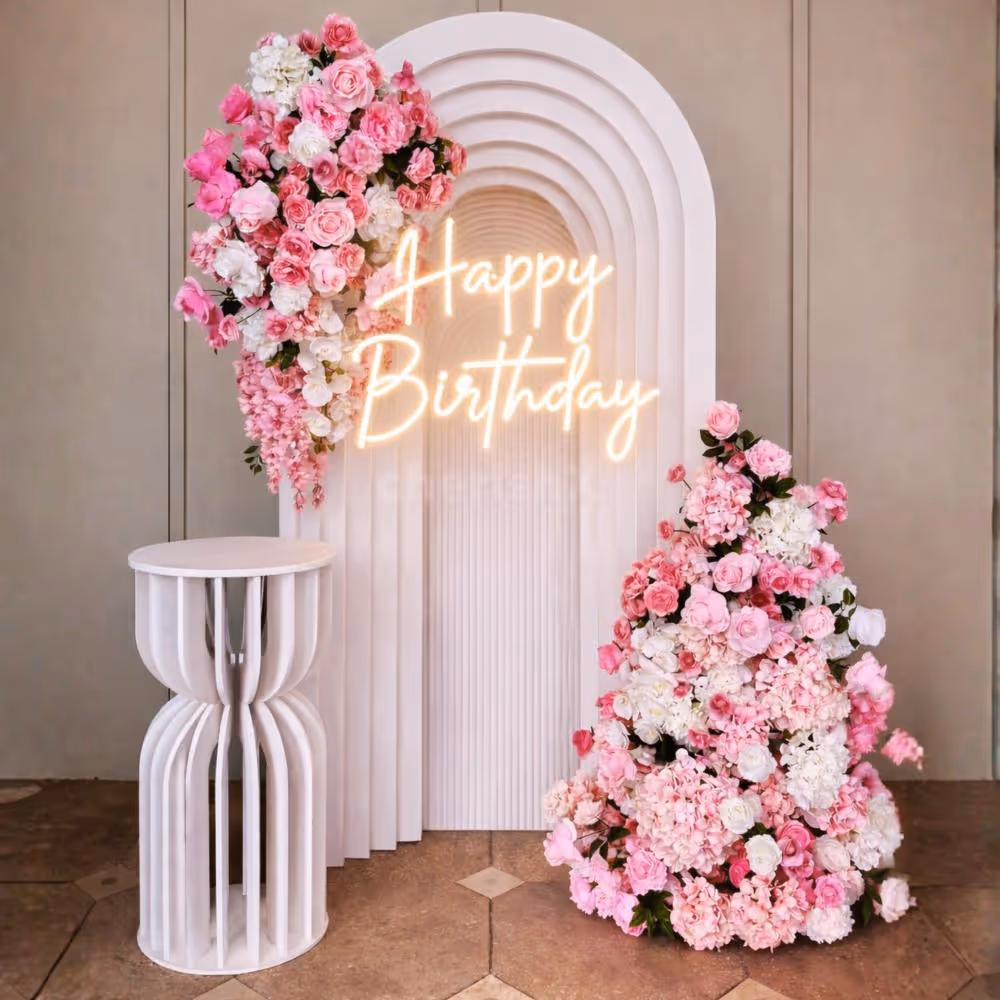 A white sunboard backdrop with a 3D effect adds to the visual appeal of the birthday spot.