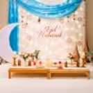 Low-lying tables adorned with props create a feast-ready atmosphere at the venue.