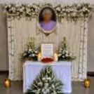 The White Flower Backdrop Creates A Peaceful And Calming Remembrance Setup