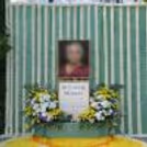Center Photo Frame Placed With An Elegant Tribute And A Message Board For A Remembrance Ceremony.