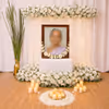 Elegant Backdrop With White Flowers Create A Calm And Sacred Farewell Setup