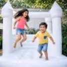 The White Dream House-Inspired Bouncy Castle At The Kids' Event Is A Star That Entices Kids Nonstop.