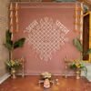 Chowki Setup Placed Neatly In Front Of Flex Backdrop With Stand For The Baby’s Ritual