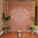 Chowki Setup Placed Neatly In Front Of Flex Backdrop With Stand For The Baby’s Ritual