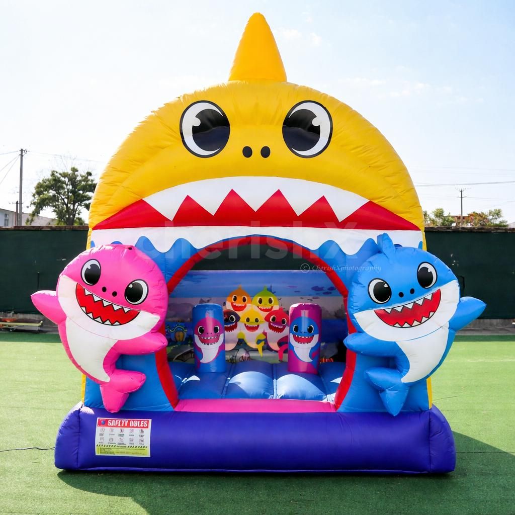 Colorful Baby Shark inflatable design with a playful cartoon theme for a kid's birthday party.