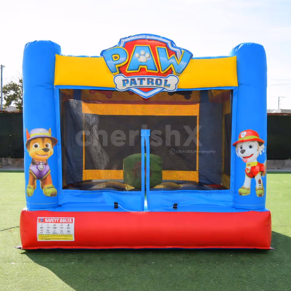 Bright Paw Patrol themed bouncy house with colorful inflatable setup for kids' party