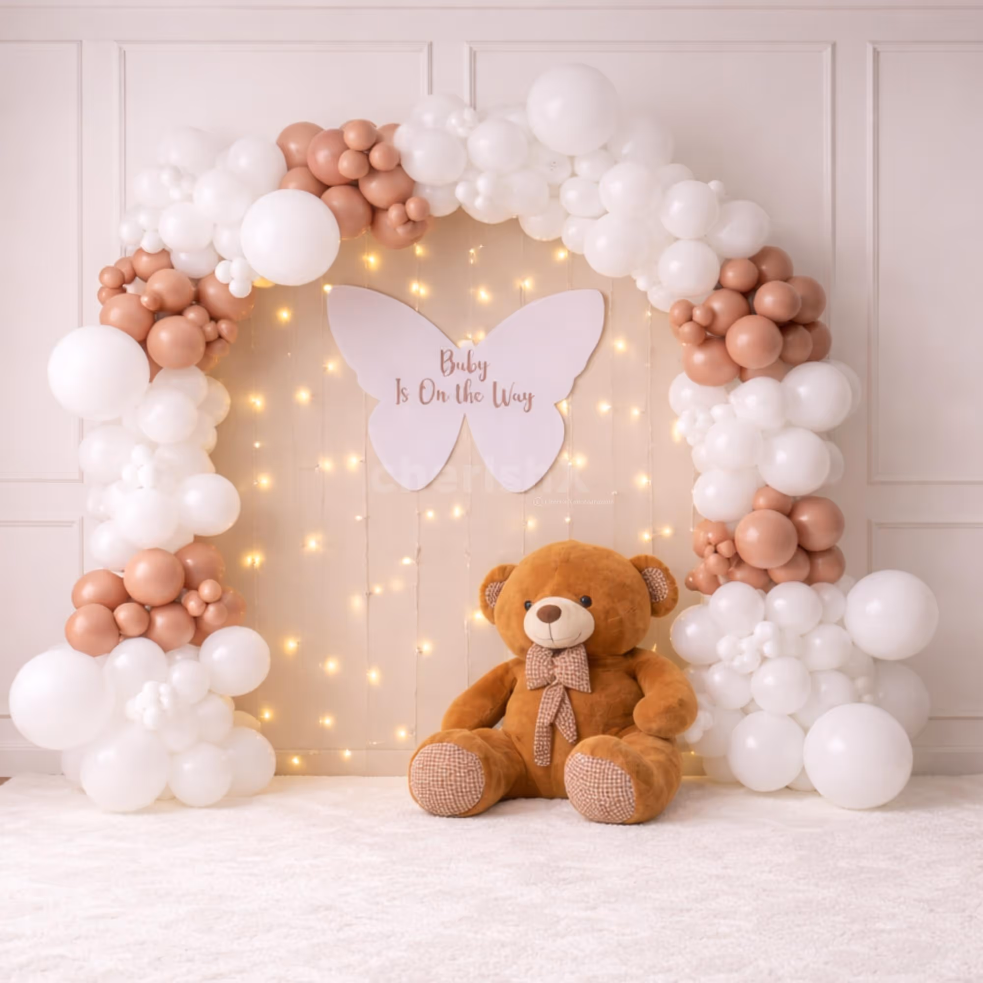 Balloon Arch Backdrop With Teddy Bear And Glowing Warm Lights For A Baby Shower Celebration