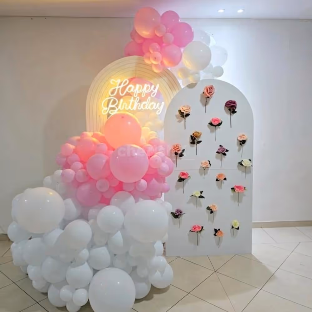 Pink And White Balloon Arch With Neon Birthday Signage Setup Looks Picture Perfect