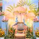 Baby Shower Theme Crafted With Flower Pots And Fresh Flower Arrangements.
