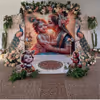 Radha-Krishna Themed Baby Shower Backdrop With Floral Décor And Peacock Elements