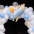 Aeroplane Foil Balloon Placed In The Center Of The Pastel Balloon Arch Adds Uniqueness