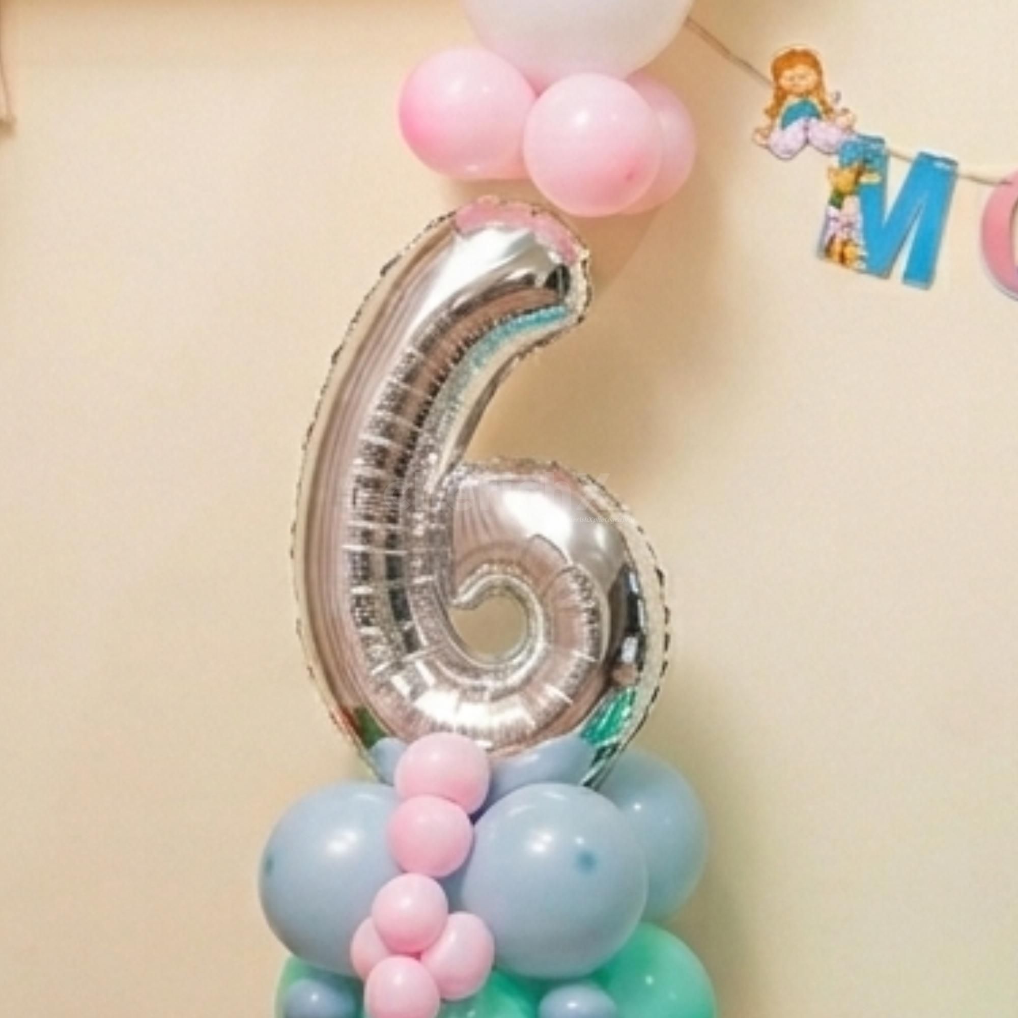 Cute Pastel-Colored Balloons Create A Beautiful Display For A Half-Birthday Party.