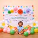 Multicolour Round Paper Buntings Adding Fun Decoration Above The Banner.