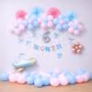 Celebrate your little one's milestone with an elegant half birthday decoration setup.