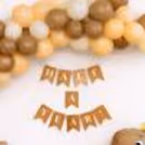 Brown-Toned Balloon Arch As The Half-Year Birthday Backdrop Is A Stunning Focal Point.