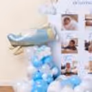 An Eye-Catching Pastel Blue And White Balloon Arch Elegantly Levels Up The Experience For Parents.