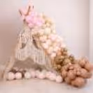 A Plush Brown Teddy In The Air Jute Basket Is The Main Attraction Of The Half-Year Birthday Party Decor.