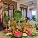 Colourful Rangoli Design With Fresh Flowers Beautifies The Entrance During The Griha Pravesh Ritual.