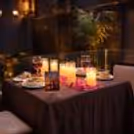 The Table Decorated With Candles And Rose Petals, Enhances The Romance In The Air