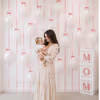White Latex Balloons On The Wall And In Boxes Add Serenity To The Ambience With Their Softness