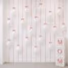White Cube Boxes With "Mom" Cutouts Create An Impressive Corner In The Mother's Day Decor