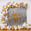 The Silver Square Frill Curtain Backdrop With Chrome Balloon Arch Makes The Glamorous Setup