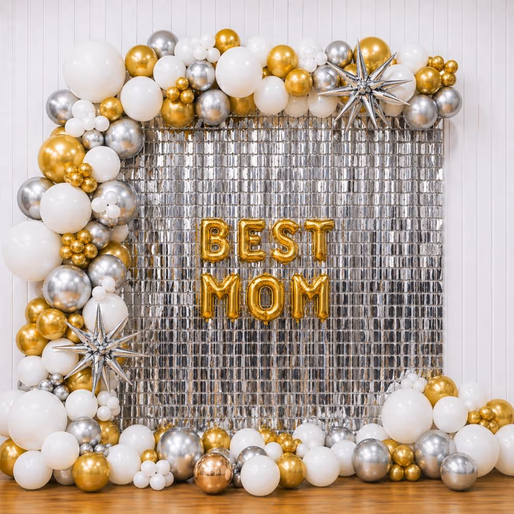 The Silver Square Frill Curtain Backdrop With Chrome Balloon Arch Makes The Glamorous Setup