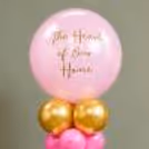 Spread Message Of Mother's Day With A Golden "The Heart Of Our Home" Vinyl Sticker On A Bubble Balloon