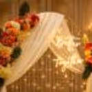 The pixel lights and flower bunches add vibrancy to the event.