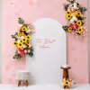 A Flex Backdrop With A Sunboard Stand Decorated With Artificial Floral Bouquets Looks Amazing.