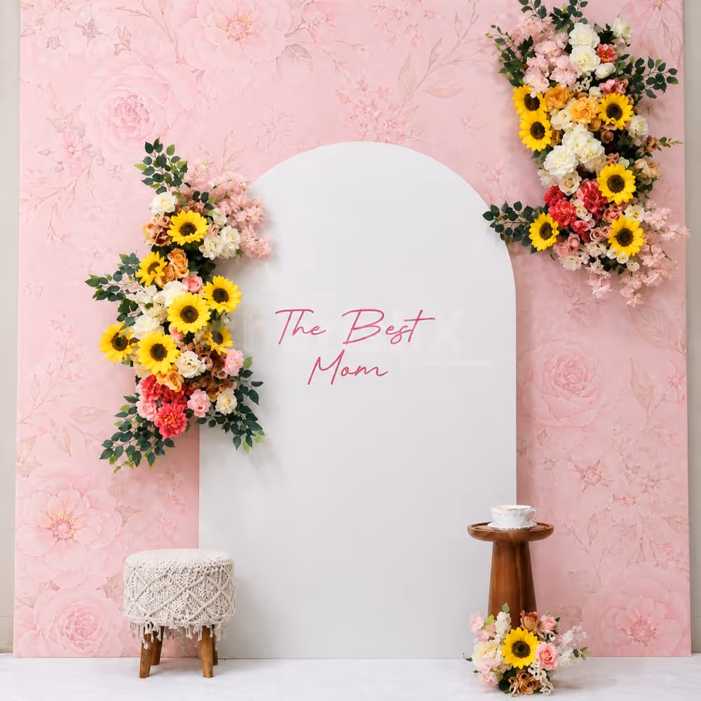 A Flex Backdrop With A Sunboard Stand Decorated With Artificial Floral Bouquets Looks Amazing.