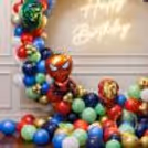 Happy Birthday, Neon Light, And Free-Floating Balloons Break The Colour Code In Birthday Decor.