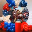 A Multi-Coloured Balloon Arch Frames The Ring Stand Perfectly, Creating An Amazing Backdrop.