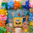 Multi-Coloured Balloon Arch Around The Flex Frames It Well And Enhances Its Playfulness.