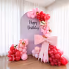 A massive-sized pink bow is the major highlight of the decor, celebrating the Flower wrapping tradition.