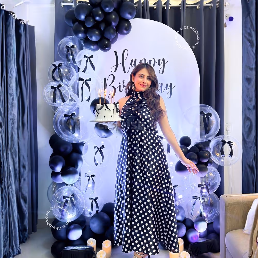 Custom sunboard cutout is framed well with black latex and clear bubble balloons