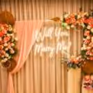 "Will You Marry Me" Neon Signage And Pink Velvet Fabric Draping Speak The Desires Aloud.