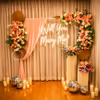 The floral decor on the sturdy stand creates a perfect backdrop for romantic proposal