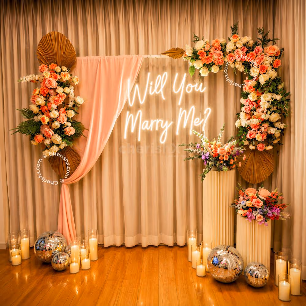 The floral decor on the sturdy stand creates a perfect backdrop for romantic proposal