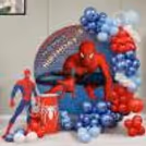 A Ring Stand With Spiderman Flex Creates A Dedicated Area For Cake-Cutting And Group Photos.