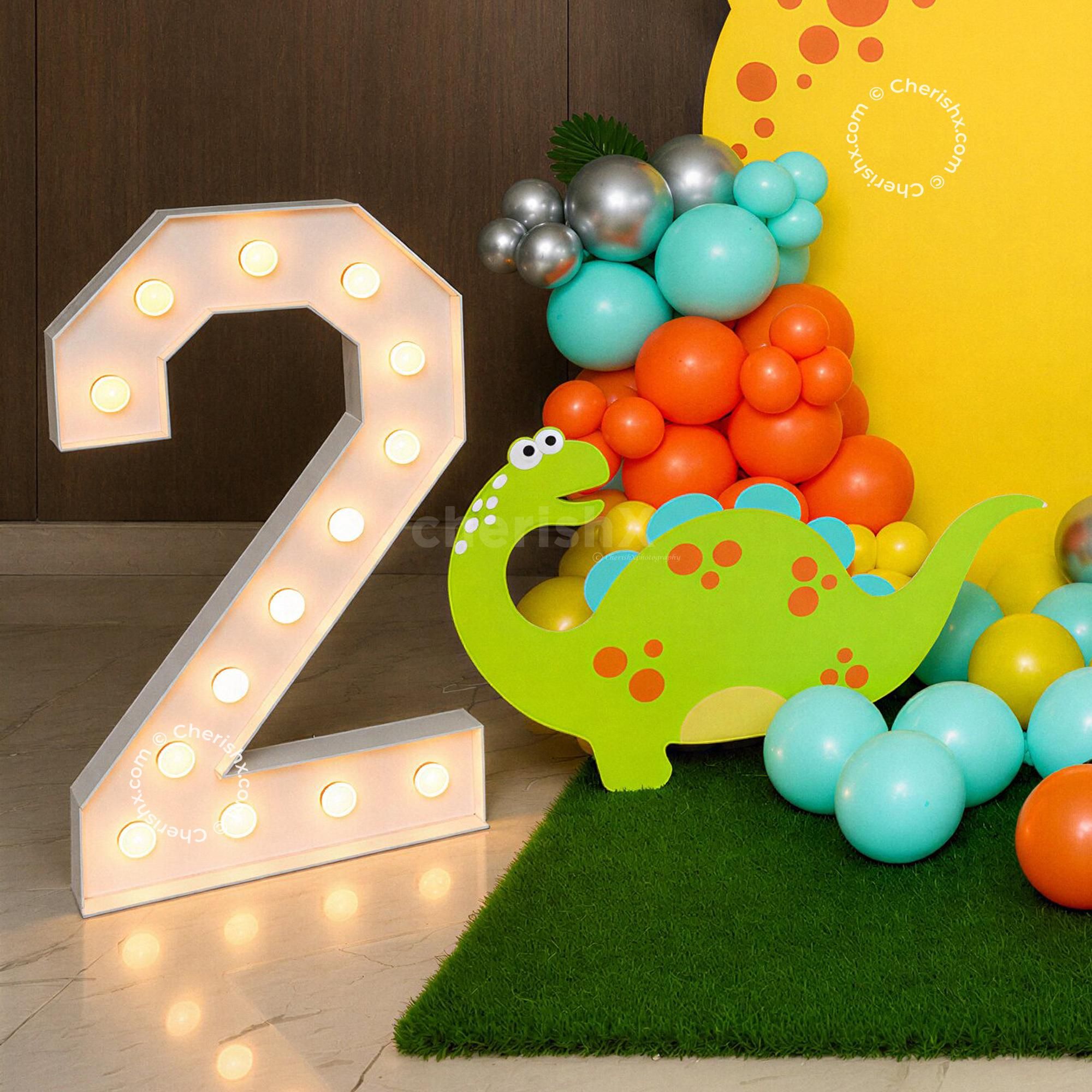 The kids will get hooked on the cake table decorated with the money plant bells.